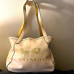 Sale coach leather with minimal stain inside but does not stain items within.